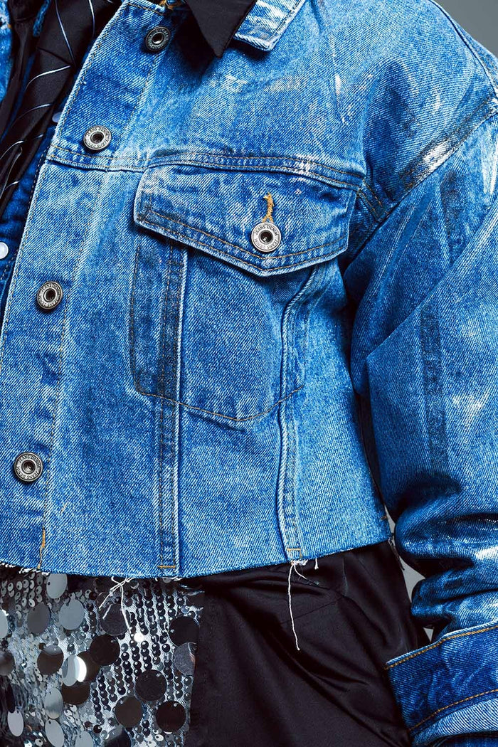 Cropped denim jacket with raw hem in mid wash with metallic silver finish
