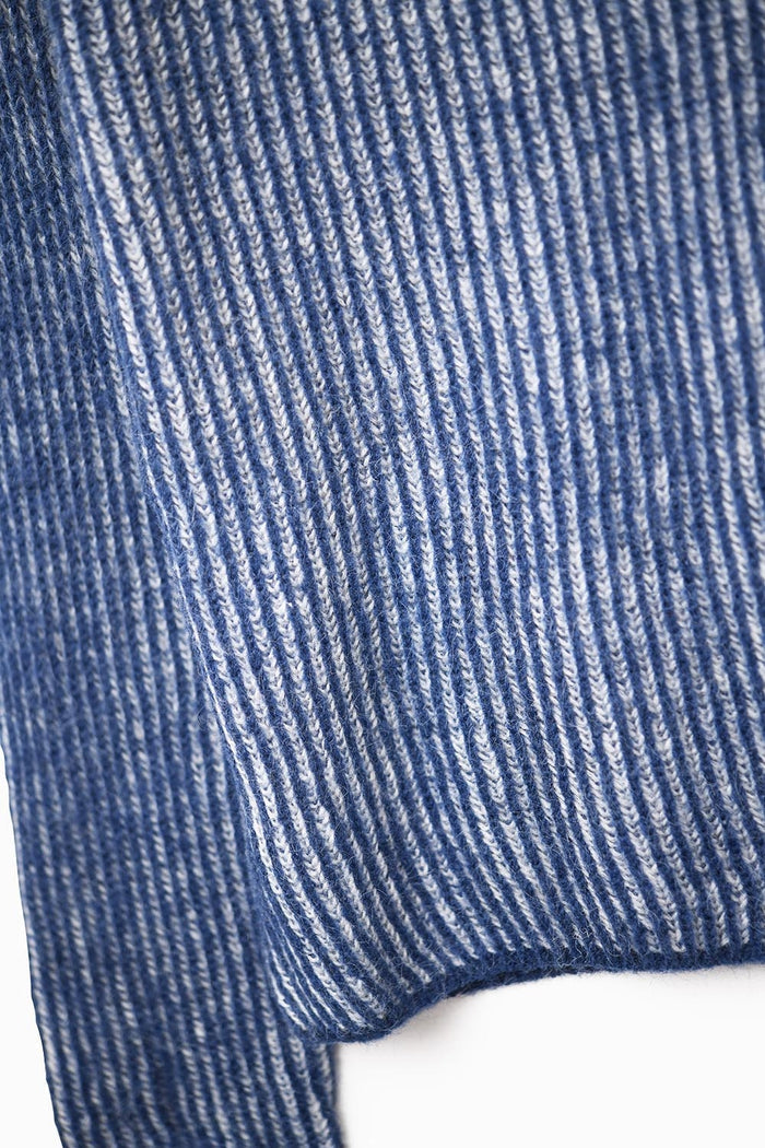 Navy blue ribbed knit sweater with a roll neck